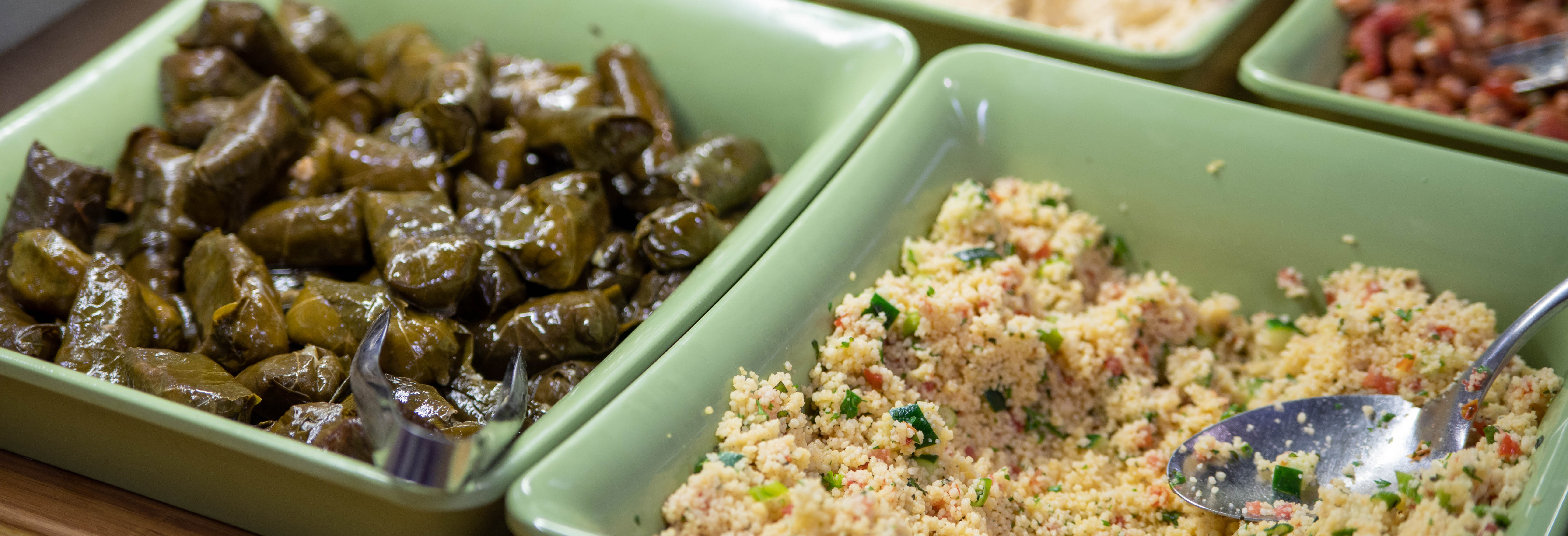 Photo of stuffed grape leaves and couscous.