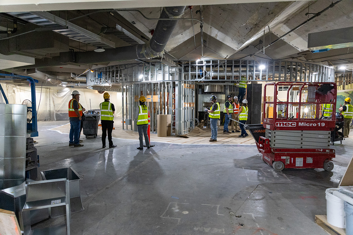 people in safety vests and hard hats at southside construction site