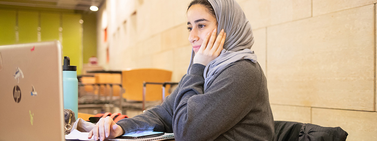 A girl on her laptop.