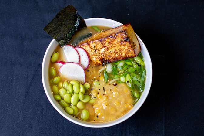 Ramen with tofu, seaweed, radishes, and corn.